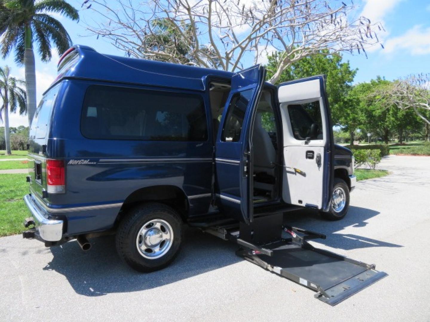 2011 Dark Blue /Gray Ford E-Series Wagon E-350 XLT Super Duty (1FBNE3BS4BD) with an 6.8L V10 SOHC 20V engine, located at 4301 Oak Circle #19, Boca Raton, FL, 33431, (954) 561-2499, 26.388861, -80.084038 - You are looking at a Gorgeous 2011 Ford Econoline E350 XLT Norcal Max High Top Handicap Wheelchair Conversion Van with 6.8L V10, 15K Original Miles, 9 Inch Lowered Floor, Braun UVL Side Entry Wheelchair Lift, Remote Control Power Side Entry Doors, Expanded Side Entry Doors, Q Straint Tie Down, Syste - Photo#52